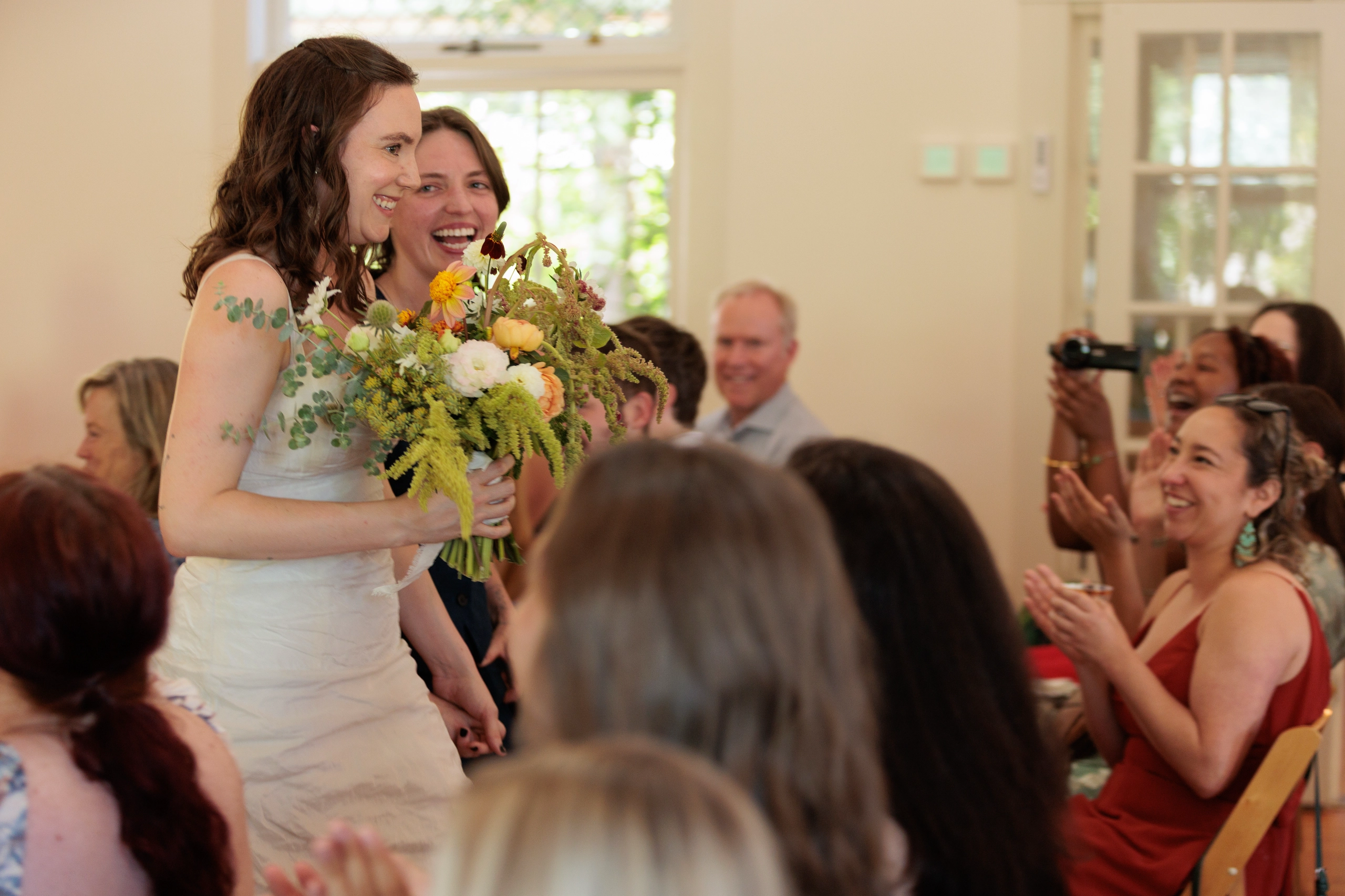 Newlyweds walking down the aisle.