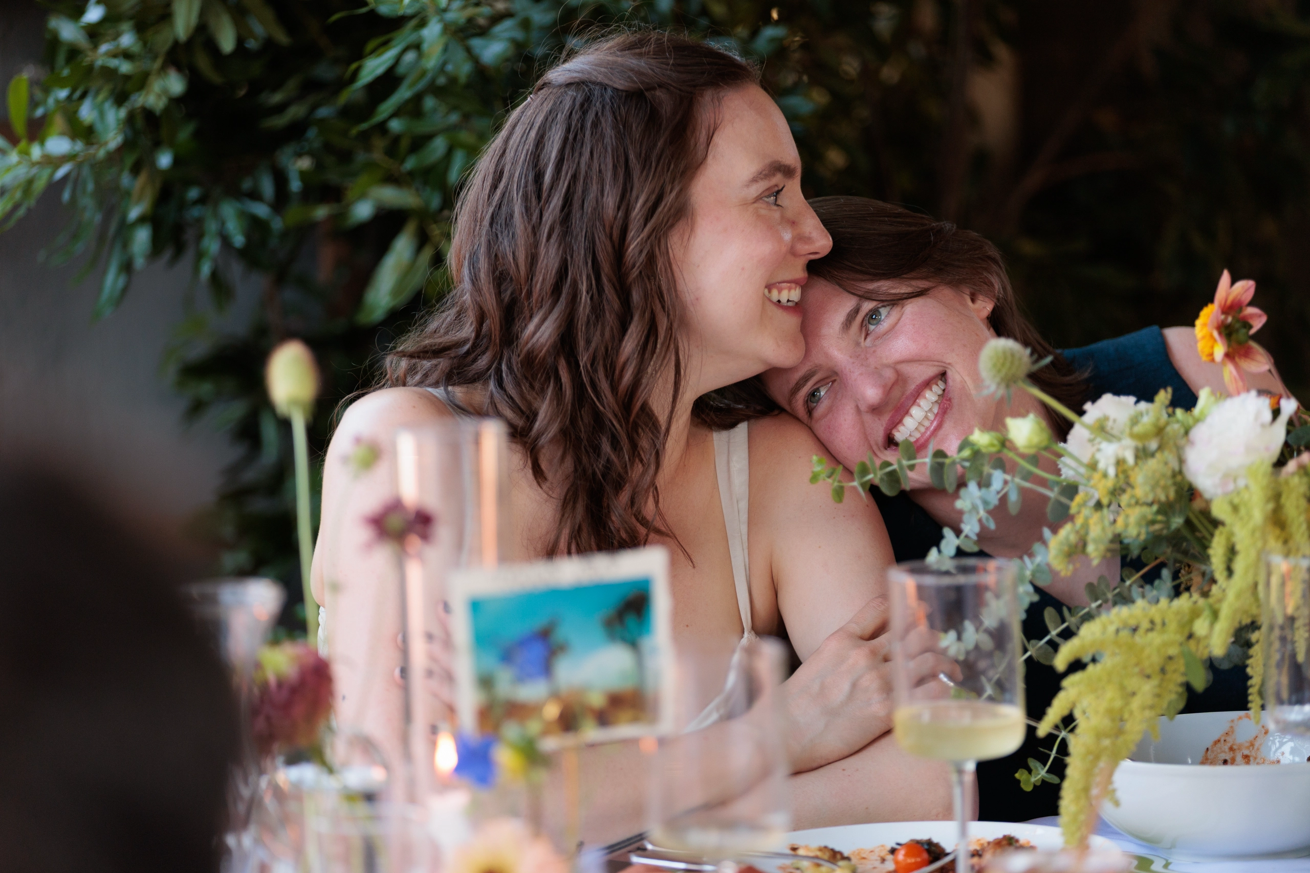 Newlyweds listen during toasts.